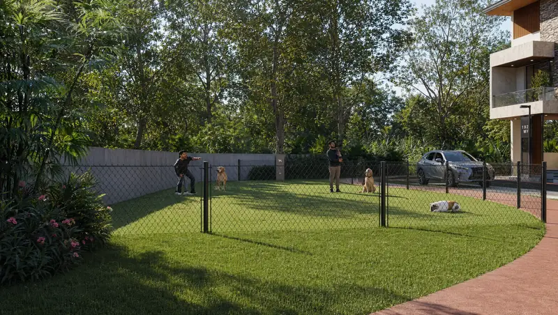 Fenced pet park with play equipment
